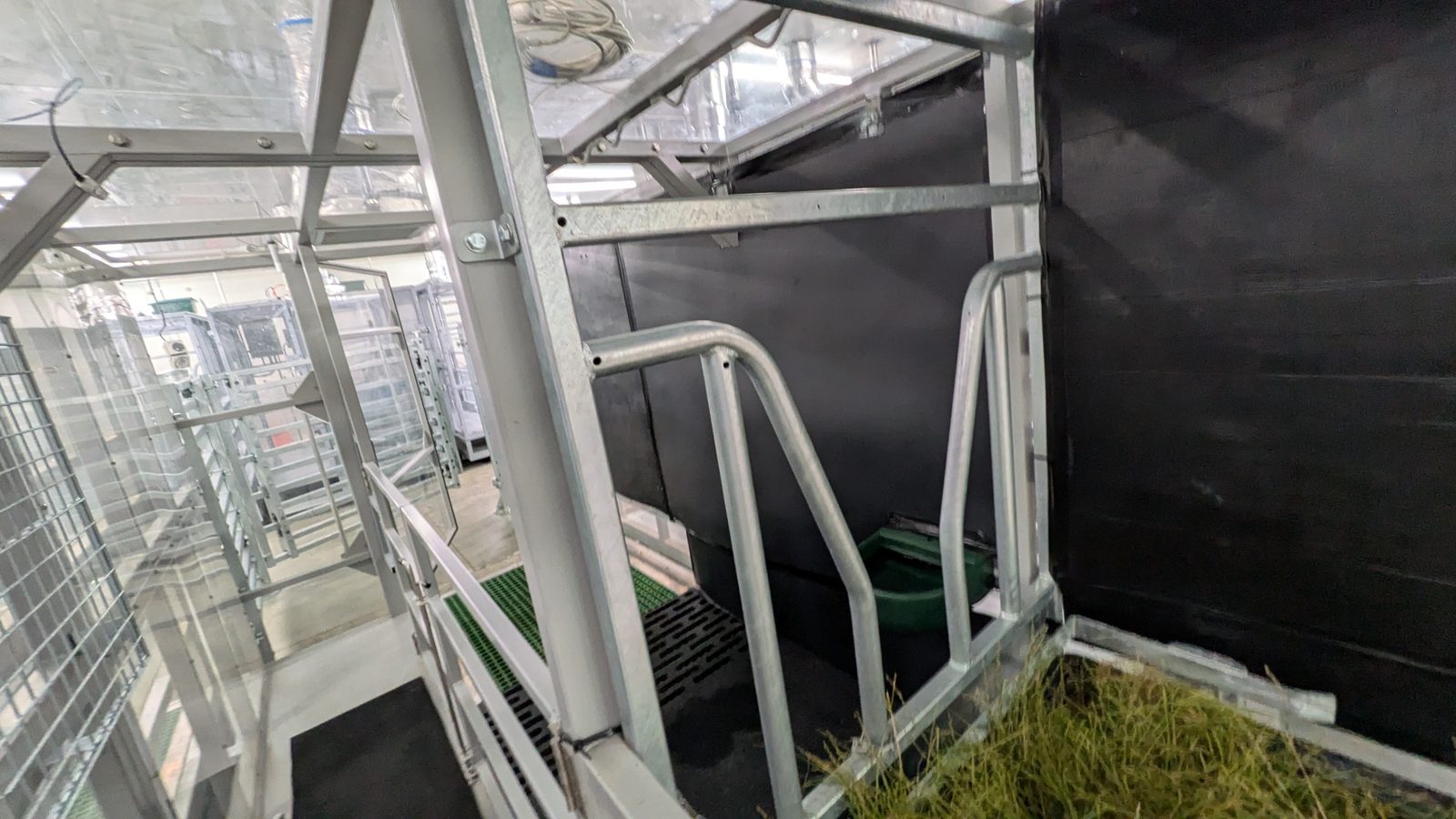 Chamber stall with a carbon-black painted backdrop wall.