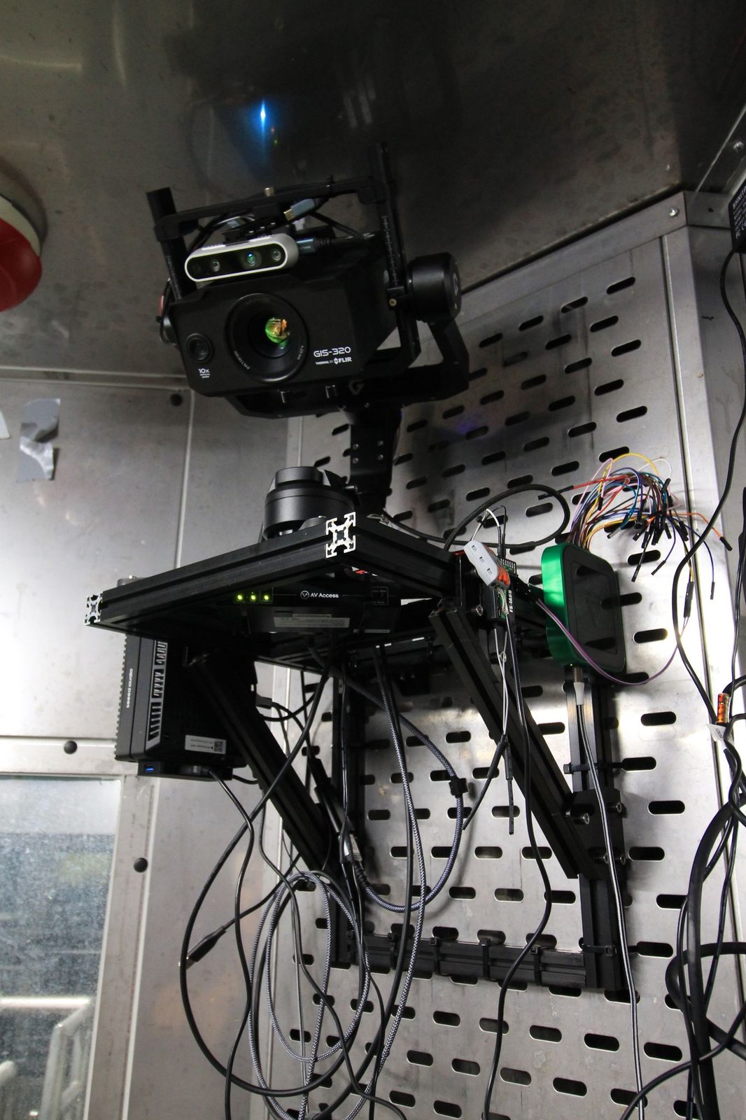 Camera package on the chamber wall: gimbal, FLIR camera, RealSense camera and electronics.